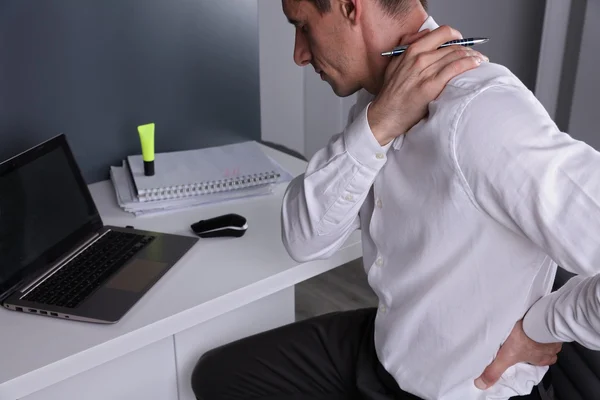 Man with Bad Posture Suffering from Neck and Back Pain